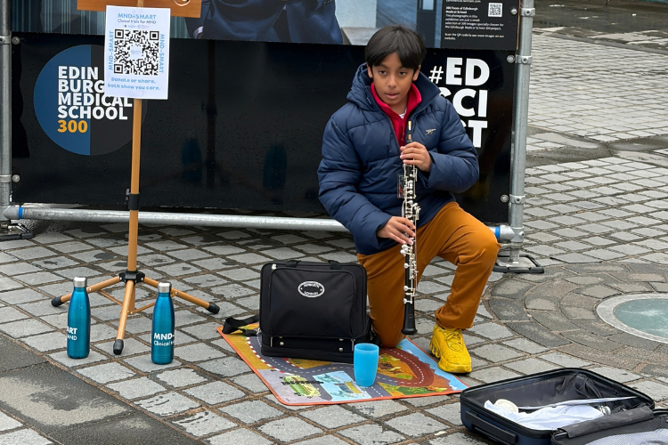 Aditya Pal busking at the Mound, Edinburgh during the Edinburgh Medical School 300 Faces Exhibition