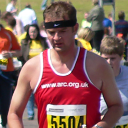 David Brook, in a running vest, taking part in a race