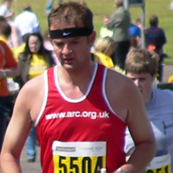 David Brook, in a running vest, taking part in a race